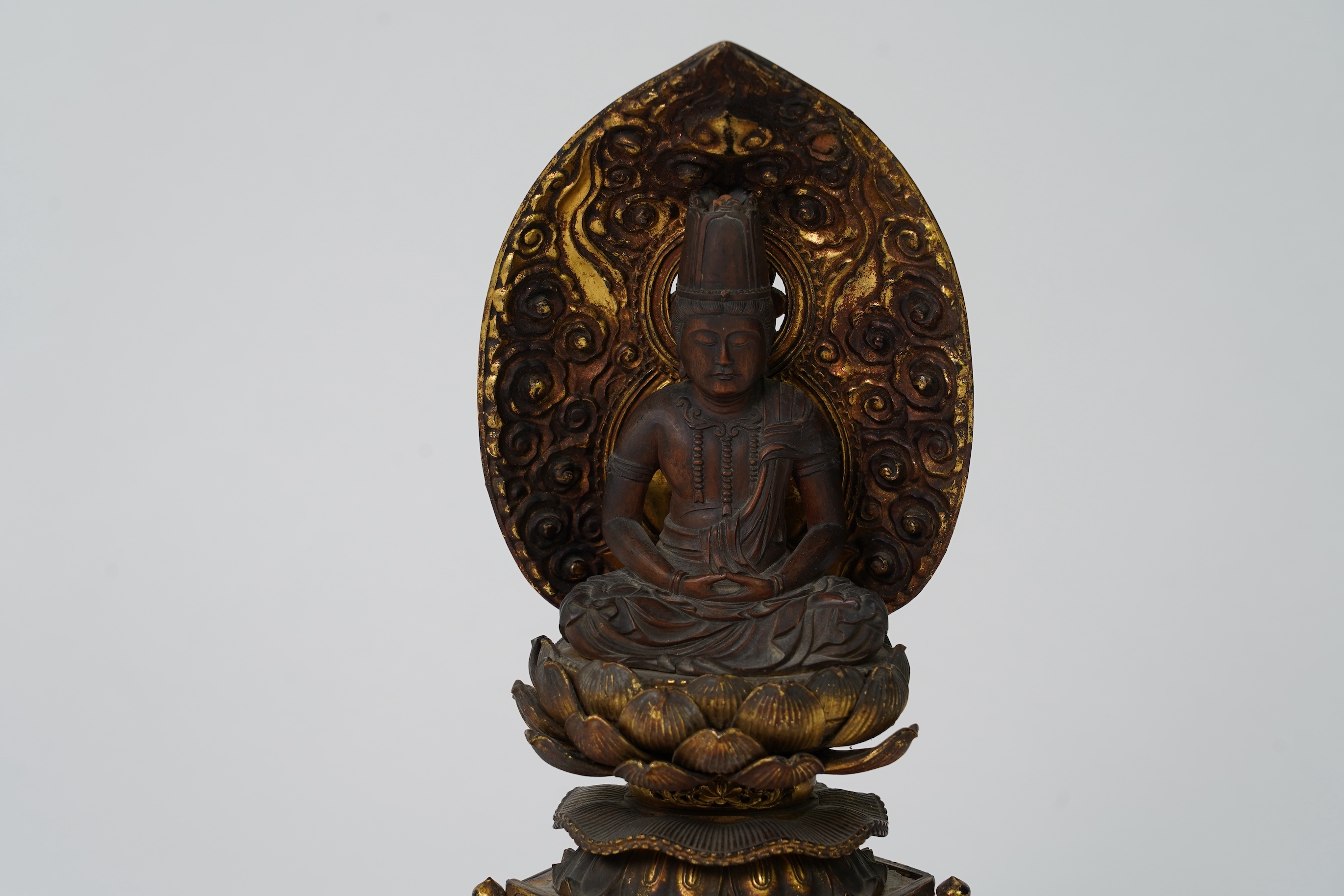 A Japanese Buddhist boxwood and giltwood seated figure of Dainichi Nyorai, 19th century
